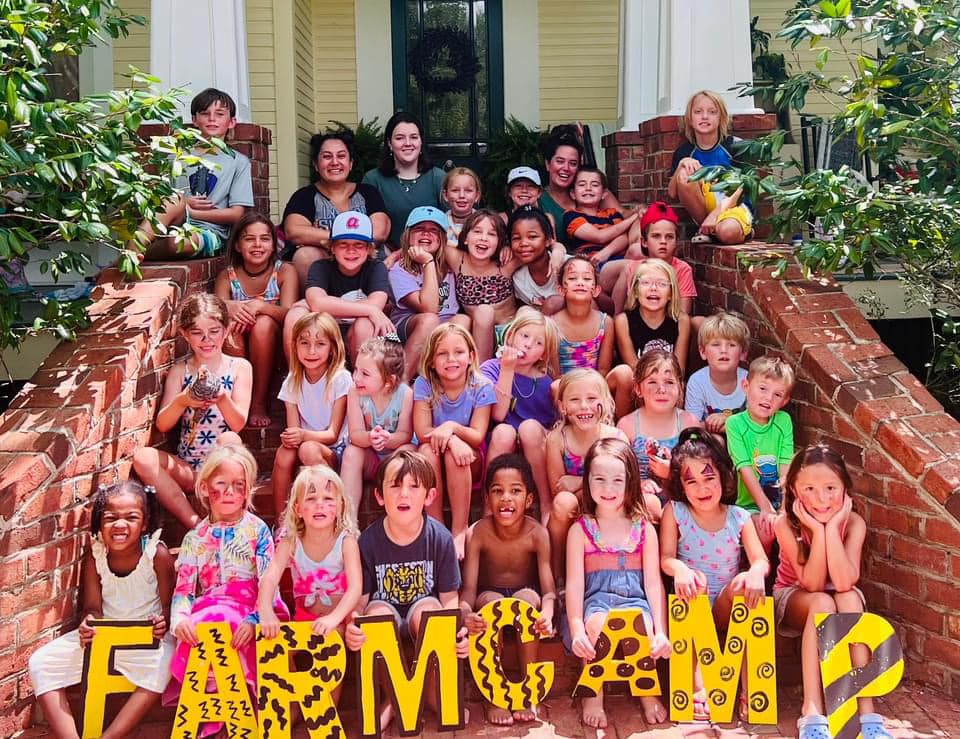 Kids holding Farm Camp letters